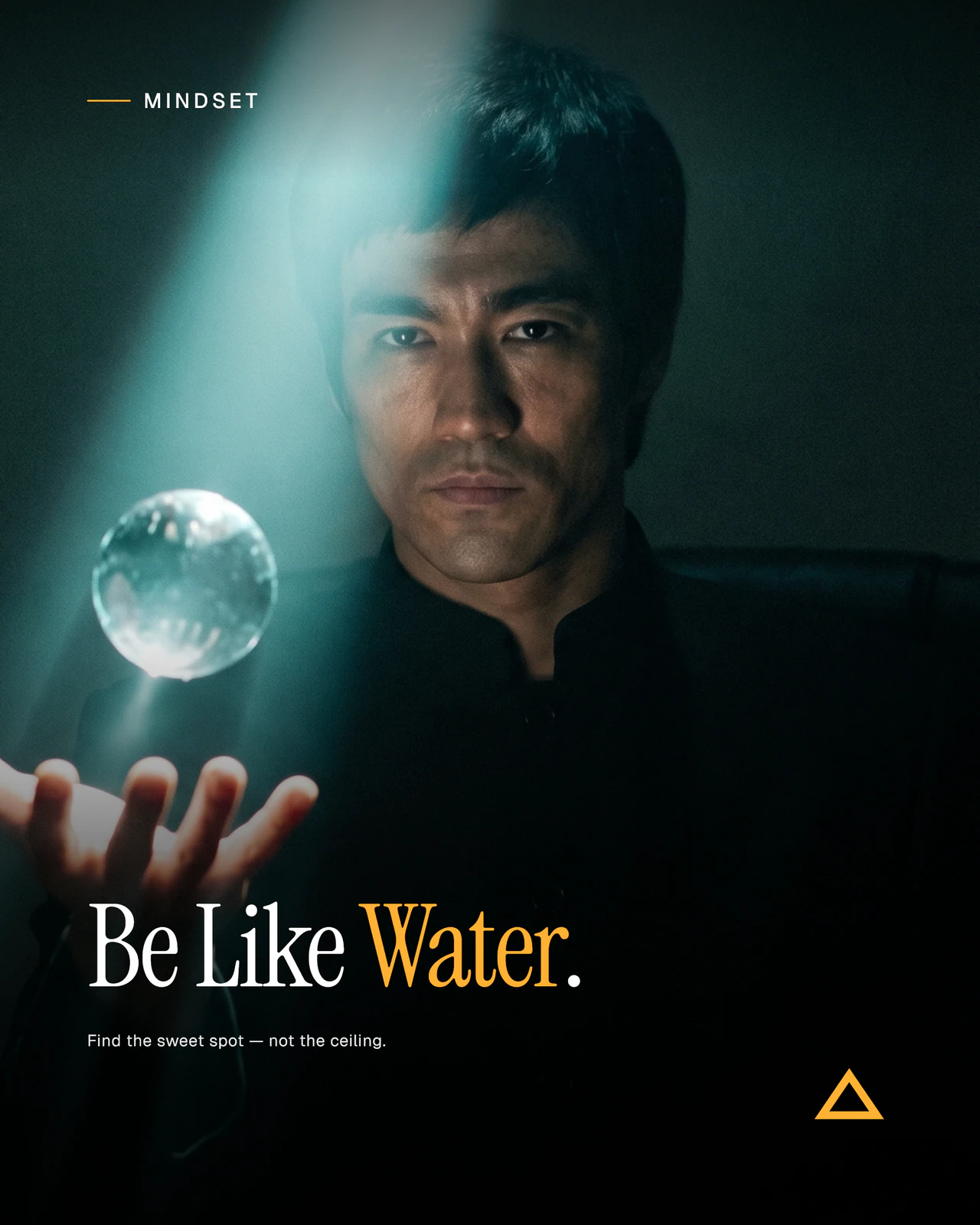 Finished Desklight 4:5 render — same man-with-glass-orb source photo, with editorial serif headline 'Be Like Water,' MINDSET kicker in mono caps, supporting line 'Find the sweet spot — not the ceiling,' and the amber Desklight triangle wordmark in the lower right.